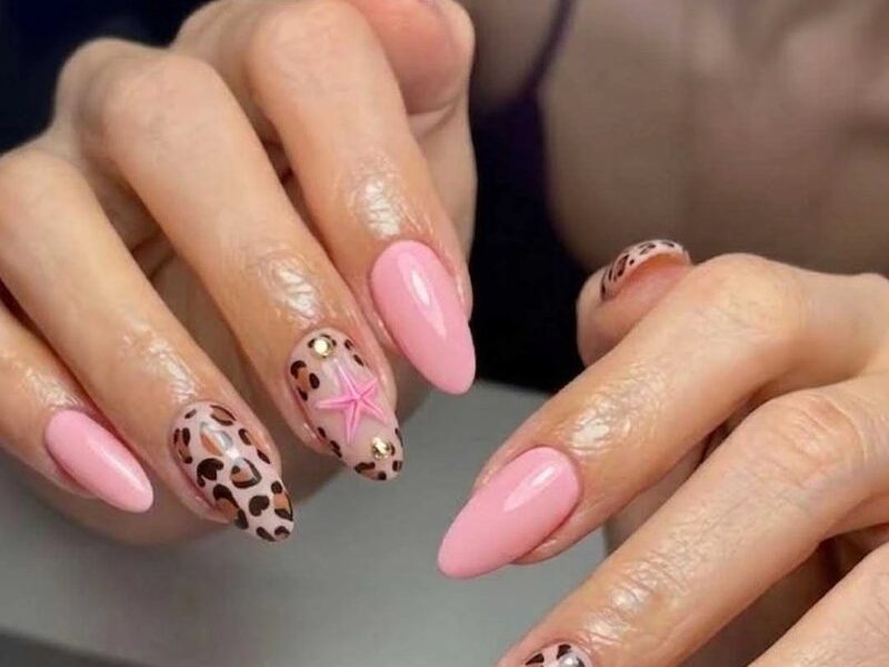 Pink almond nails with leopard print and 3D starfish accents